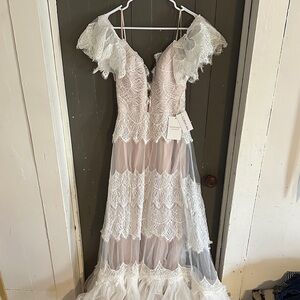 Elegant Lace Wedding Gown with Ruffle Details